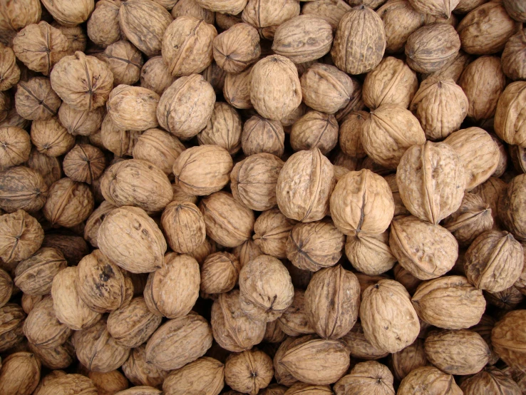 lots of nut halves are shown in this close up image