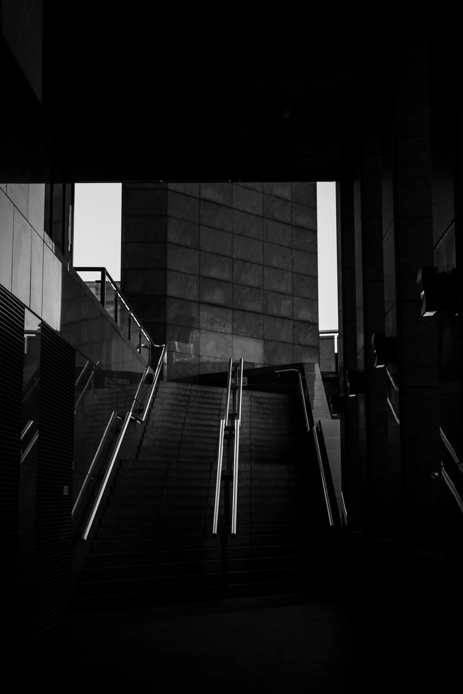 a staircase leading to an elevator on a building