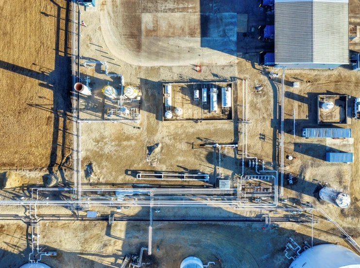 an aerial view of a farm yard with pipters