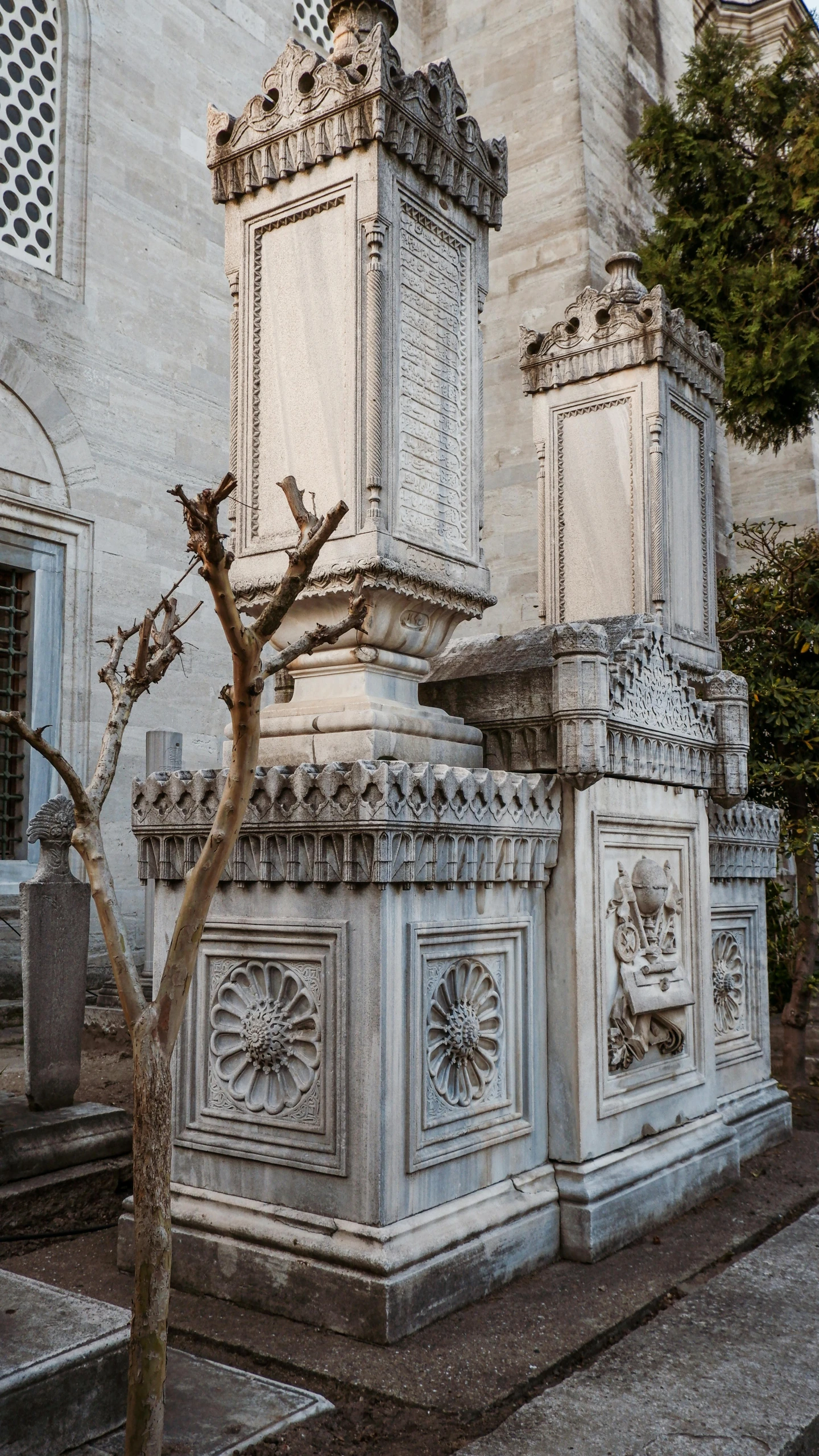 an elaborately decorated statue near steps on the street