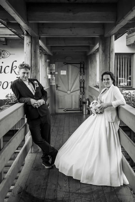 a man and a women posing on stairs next to each other