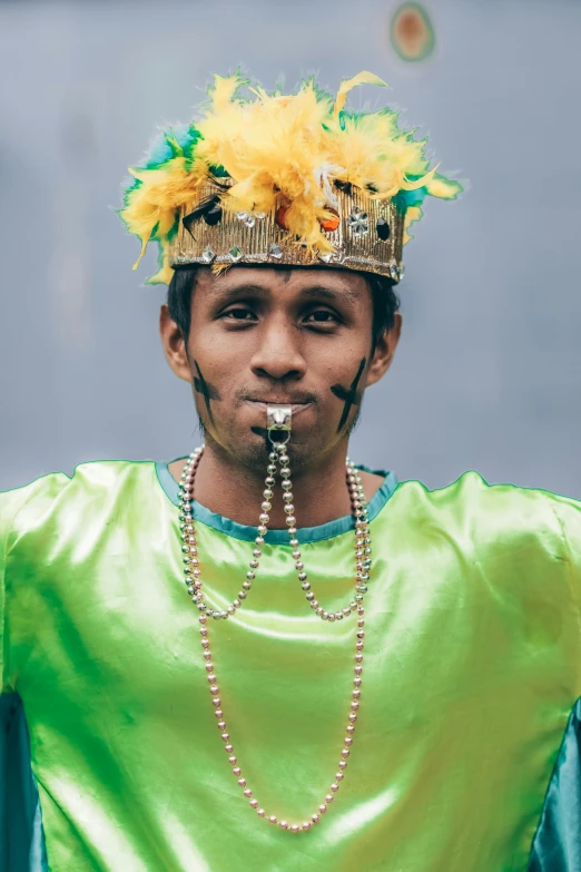 a man with a feathered crown on his head