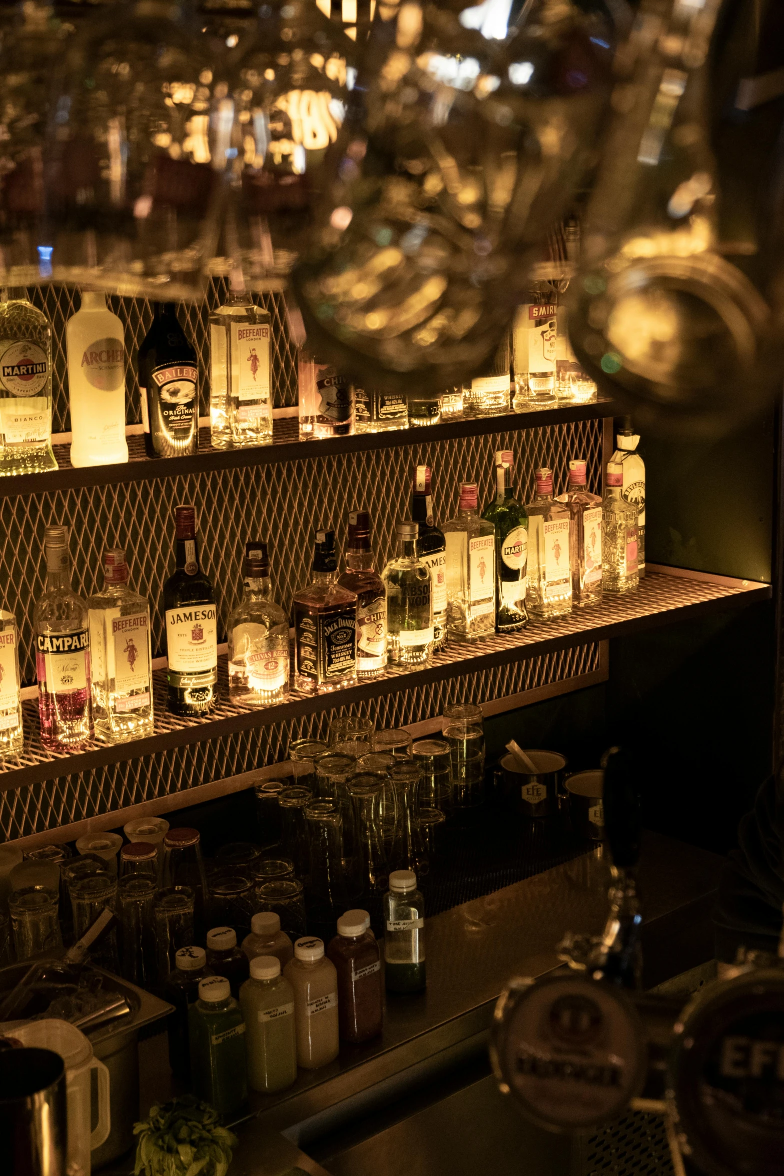 a counter topped with lots of bottles and bottles