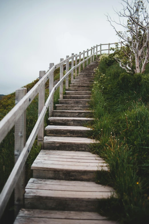 a set of stone stairs is shown at the top of the hill