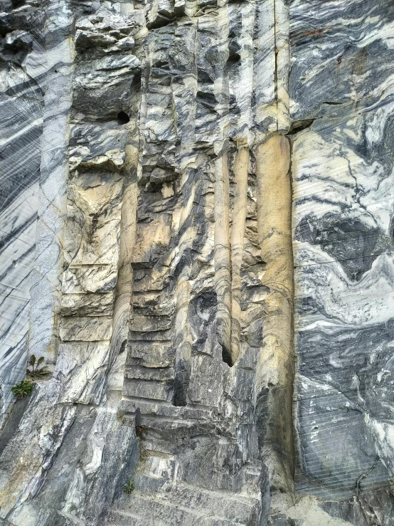 stairs are painted on a cliff face