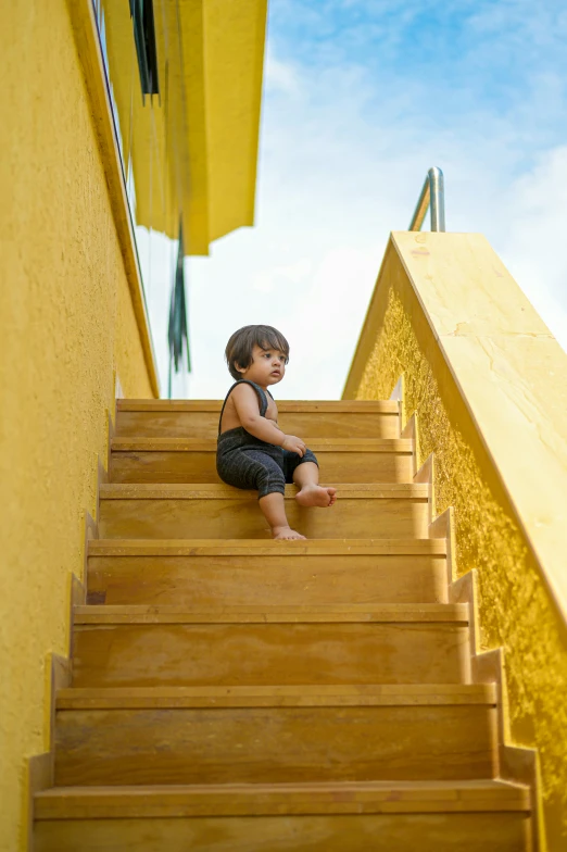 a  sitting on some stairs