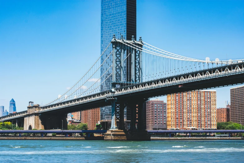 there is a bridge going under a large building