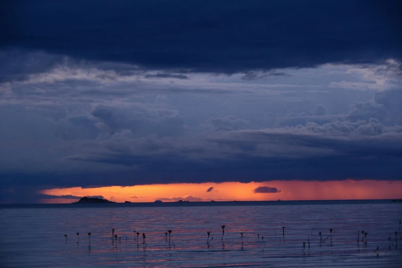 an evening sky filled with lots of dark clouds