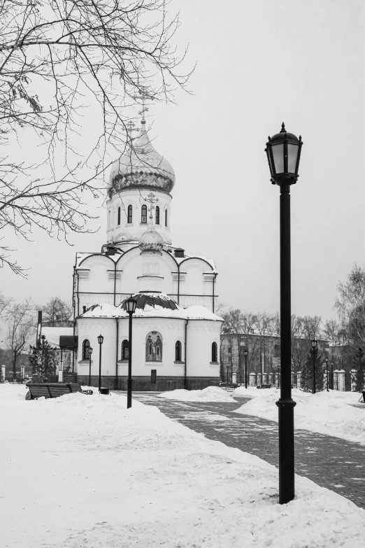 a church that is sitting in the snow