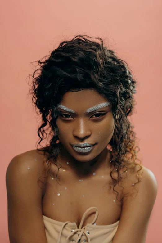 a woman with silver make up and hair