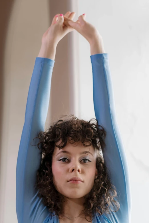 woman with her arms raised in the air