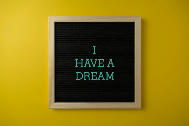 a black framed sign with text that says i have a dream