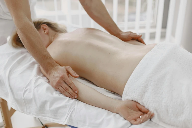 a woman getting a massage in the body of an individual