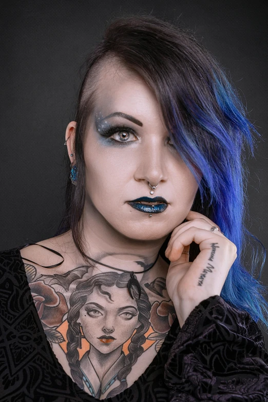 a young woman with makeup and blue hair