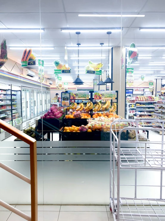 a grocery store with fruit and produce in the section