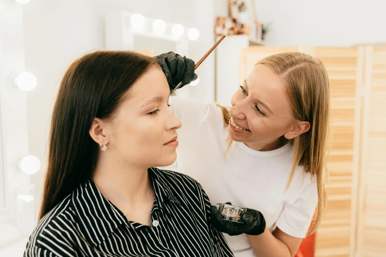 two women are getting ready to brush their hair