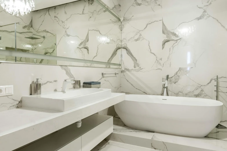 a large bathtub next to two sinks in a bathroom