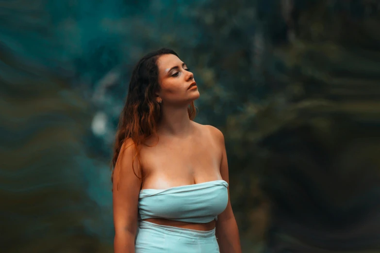 a girl with a light blue dress standing outside