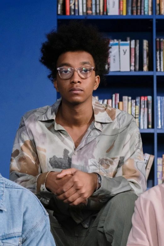 an african american young man wearing glasses