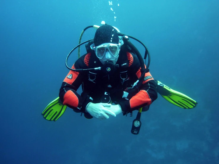 a scuba wearing black and yellow diving gear