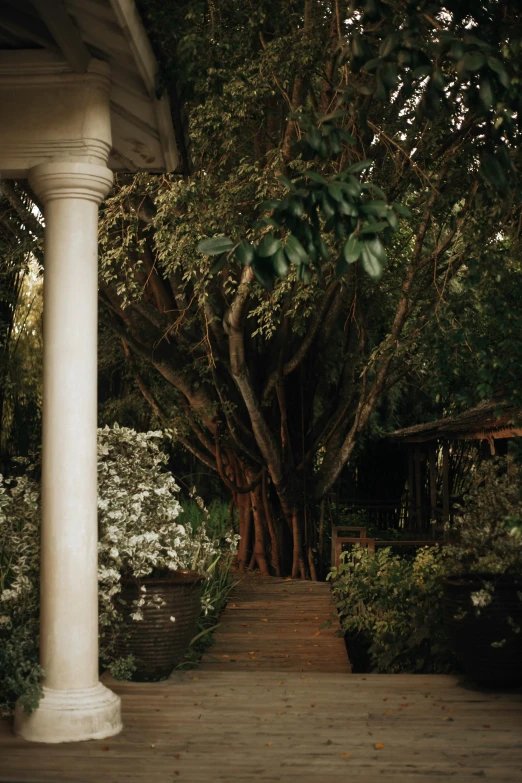 an outdoor porch with a staircase going up to the porch