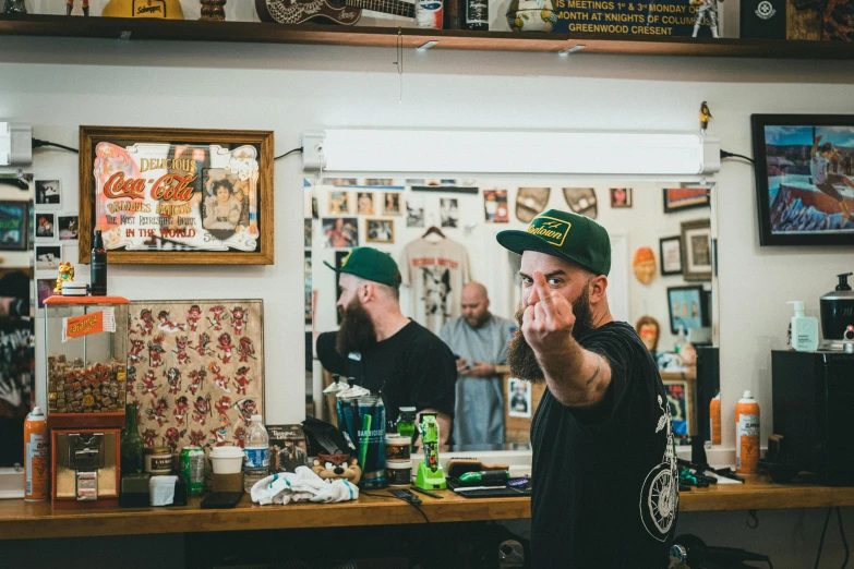 two men talking to each other while having a beer in their hand