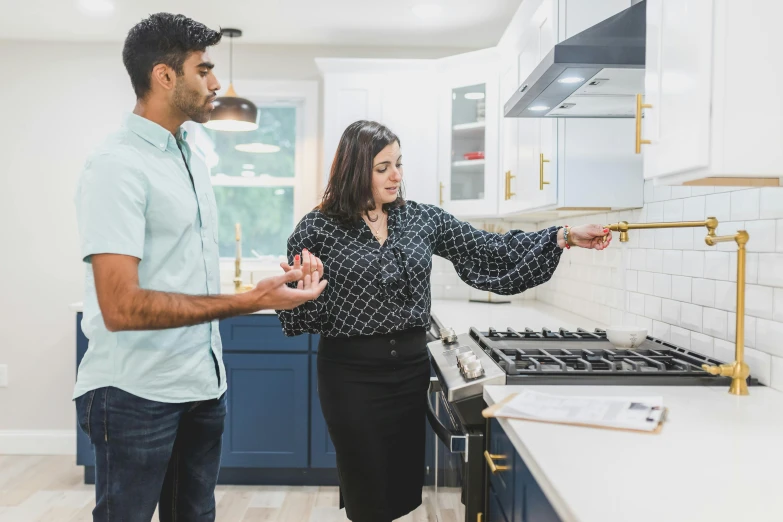 man and woman preparing food in a kitchen together