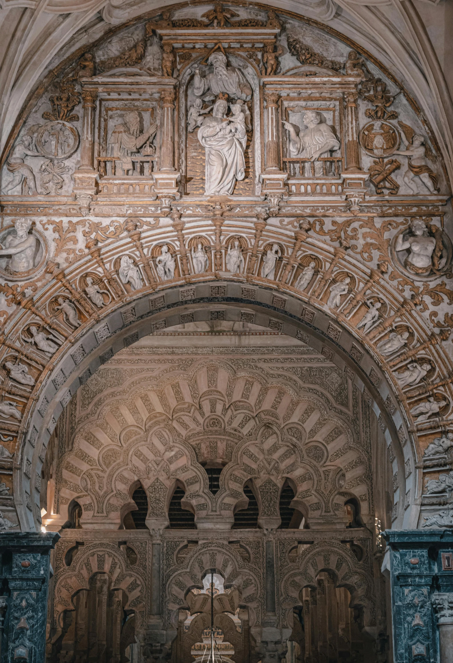 the entrance to a church filled with statues