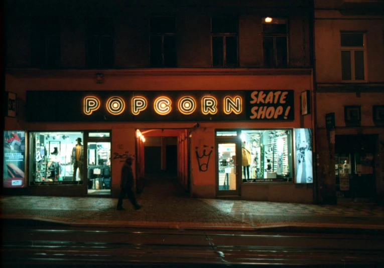 a store is at night with an open sign