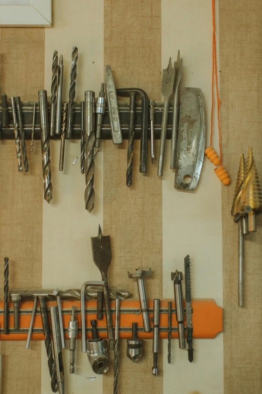 various kinds of tools hang up from a wall