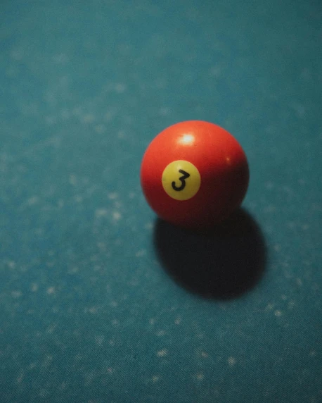 a pool table with two red balls on it