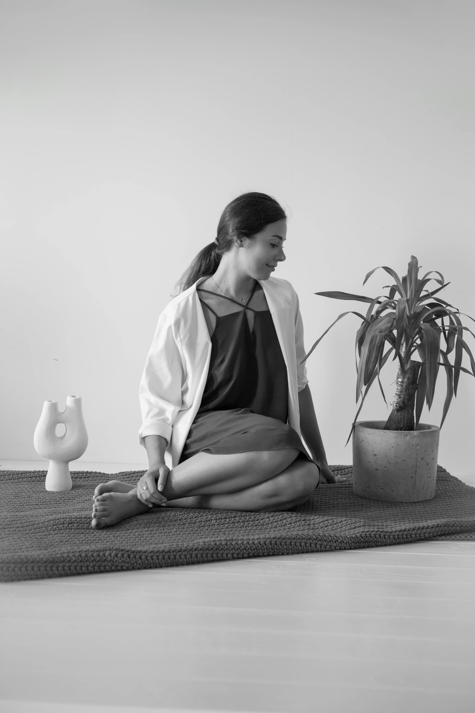 a woman is sitting in the middle of a meditation