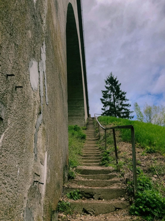 the steps lead up to the top of a cement ramp