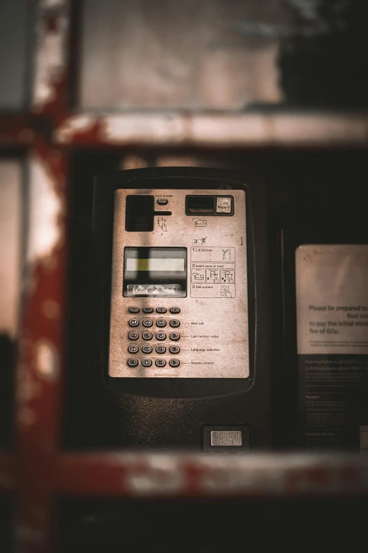 an old time payphone with the screen turned off