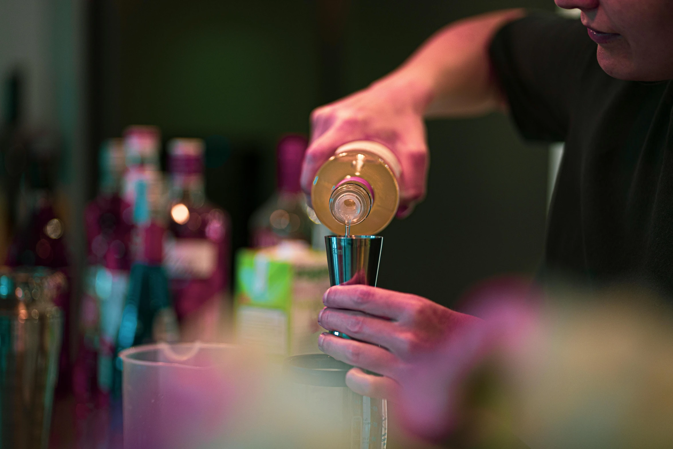 the bartender is making a drink in his bar