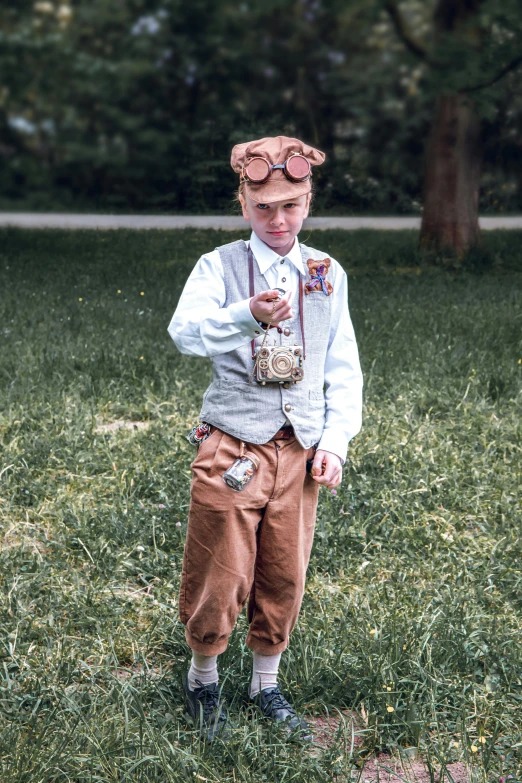 a  wearing goggles and vest holding a bottle in the grass