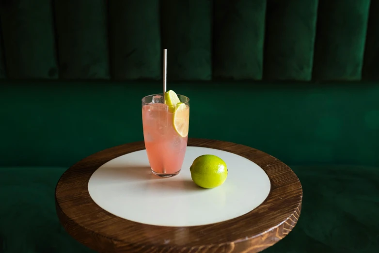 a table that has a plate with a drink on it