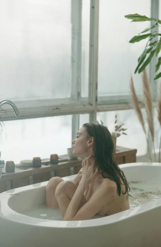 woman enjoying relaxing in spa like bath tub