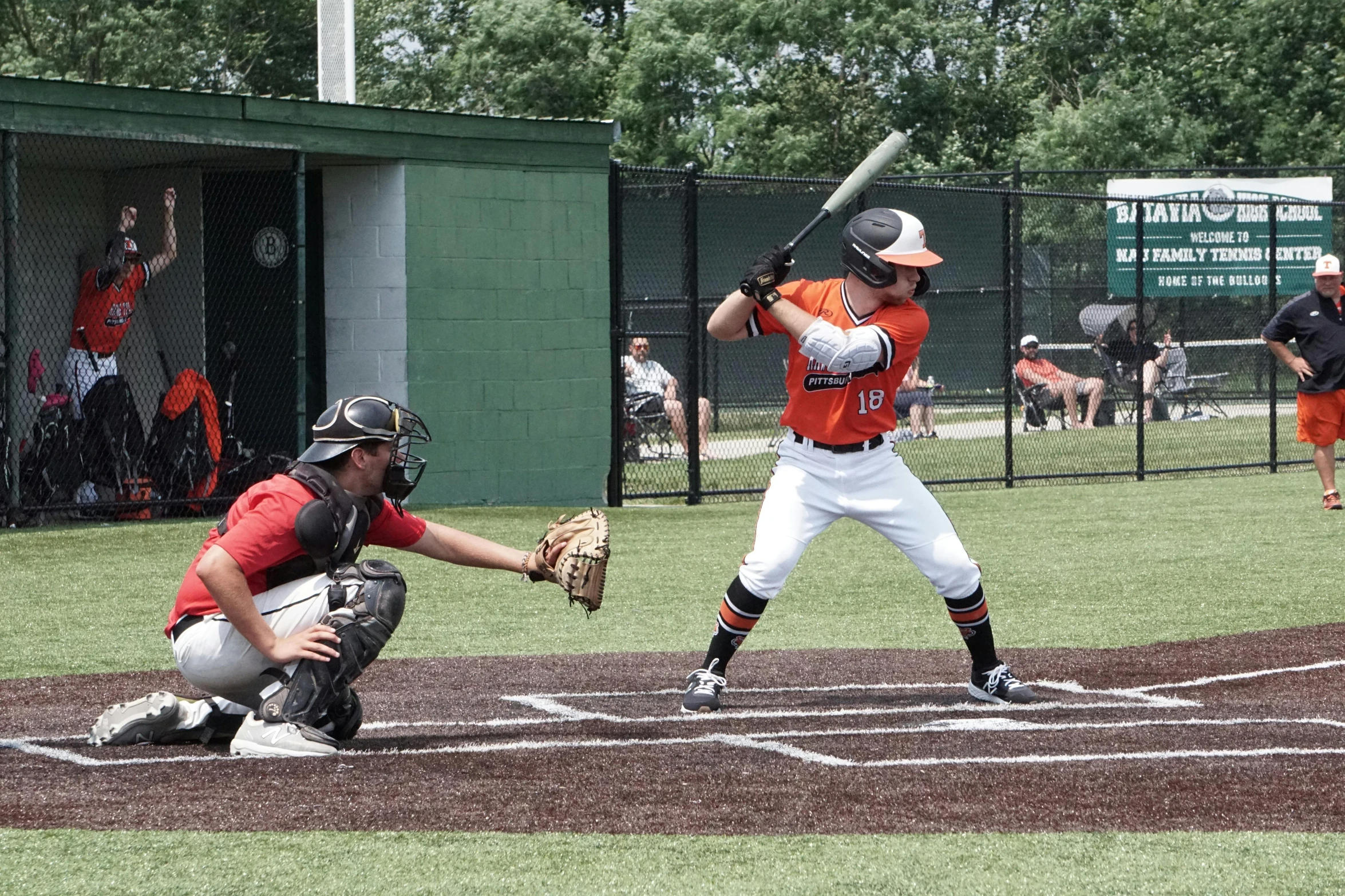 a batter, catcher and umpire on a baseball field