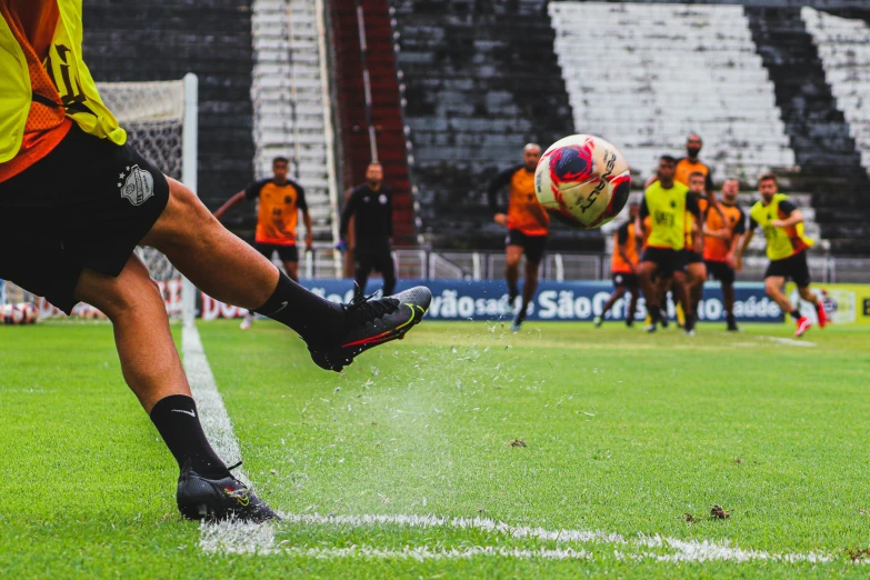 the soccer player is kicking a ball around