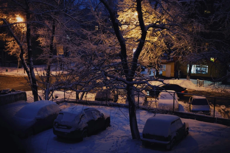 two cars sitting next to each other in the snow