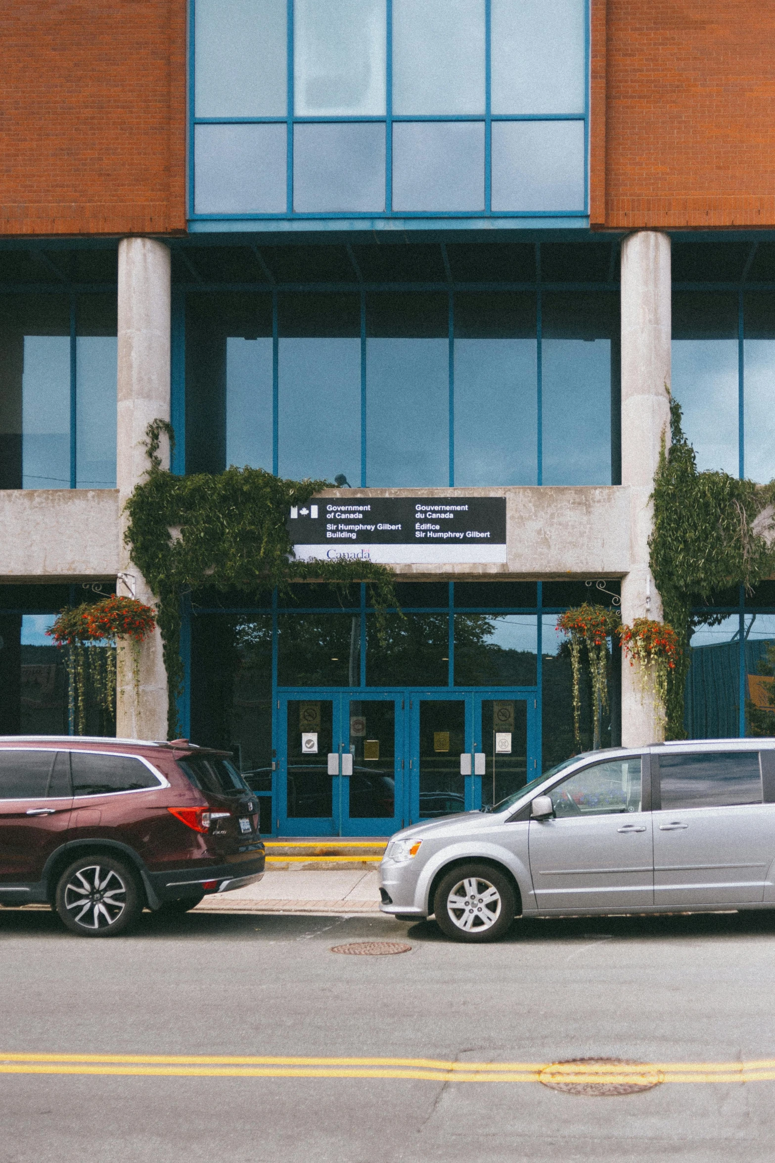 a large white building next to a two parking lots