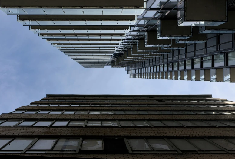 a view looking up from the top of an apartment building