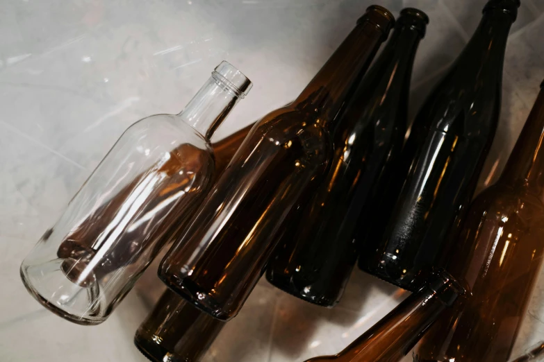 several brown bottles with lids on a counter top