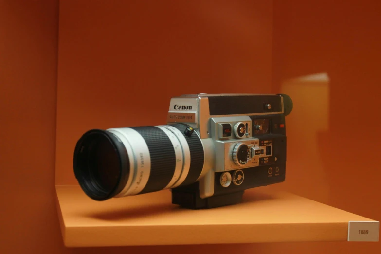a camera mounted to the wall on a shelf