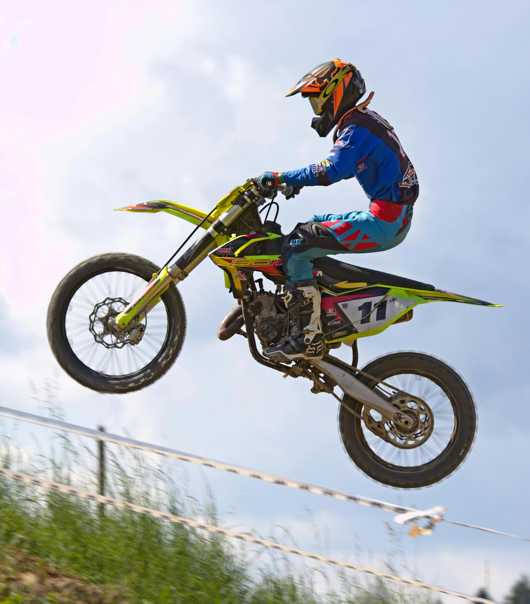 a person is flying through the air on a motorcycle