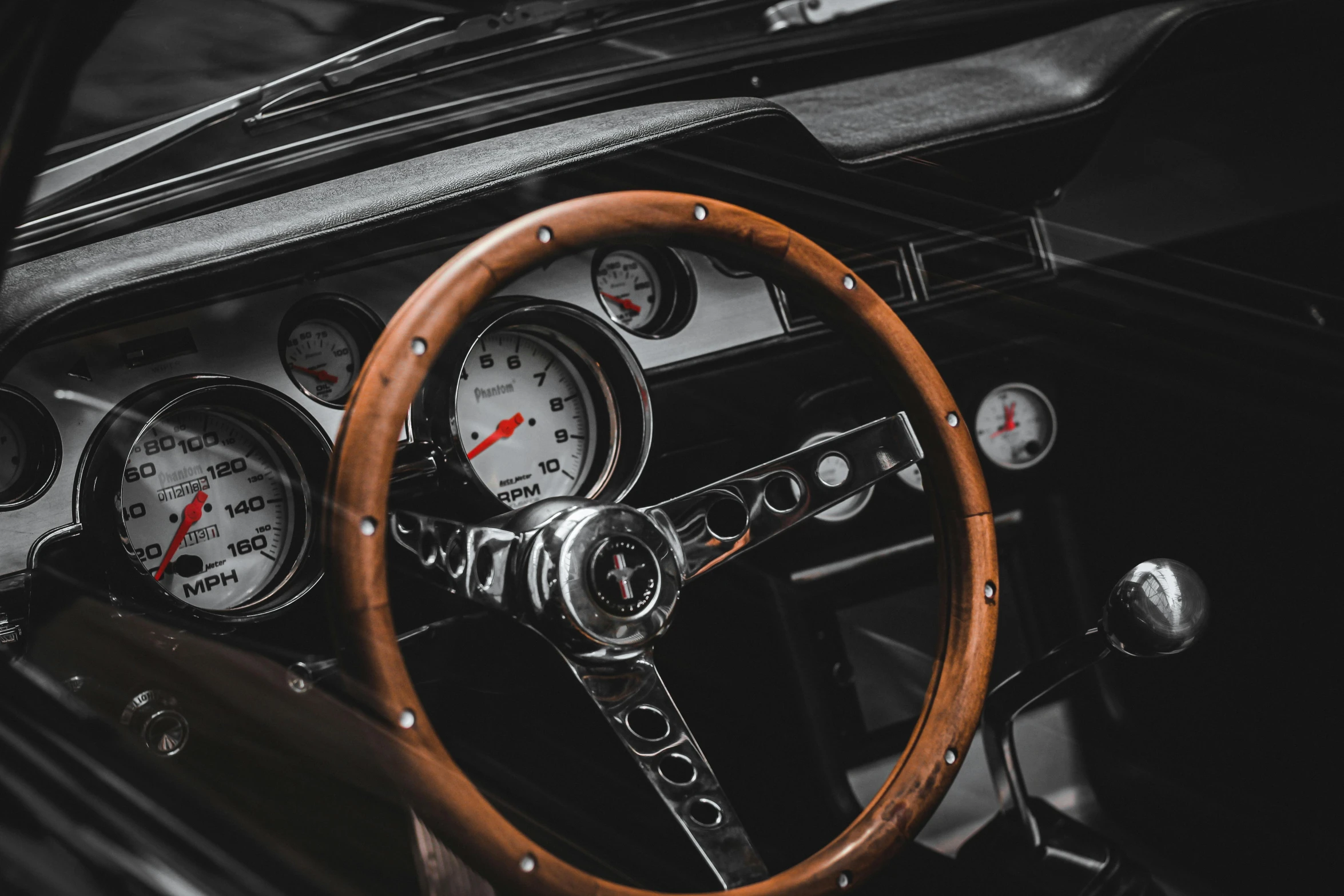 a close up view of a steering wheel, meter and dash board