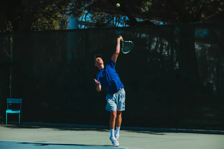 a tennis player swinging at a tennis ball