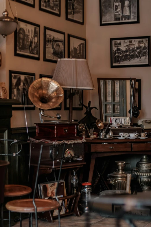 an antique desk full of antiques and pictures