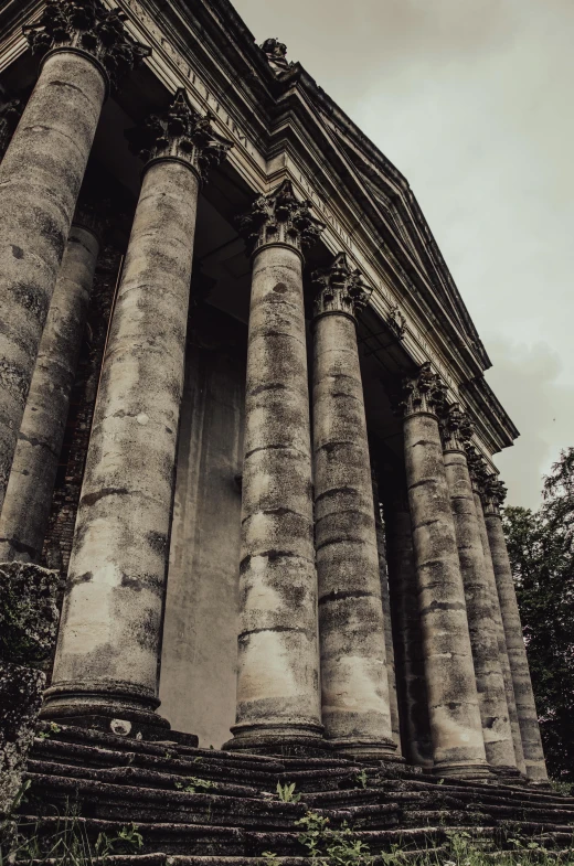 an old stone church with multiple large pillars